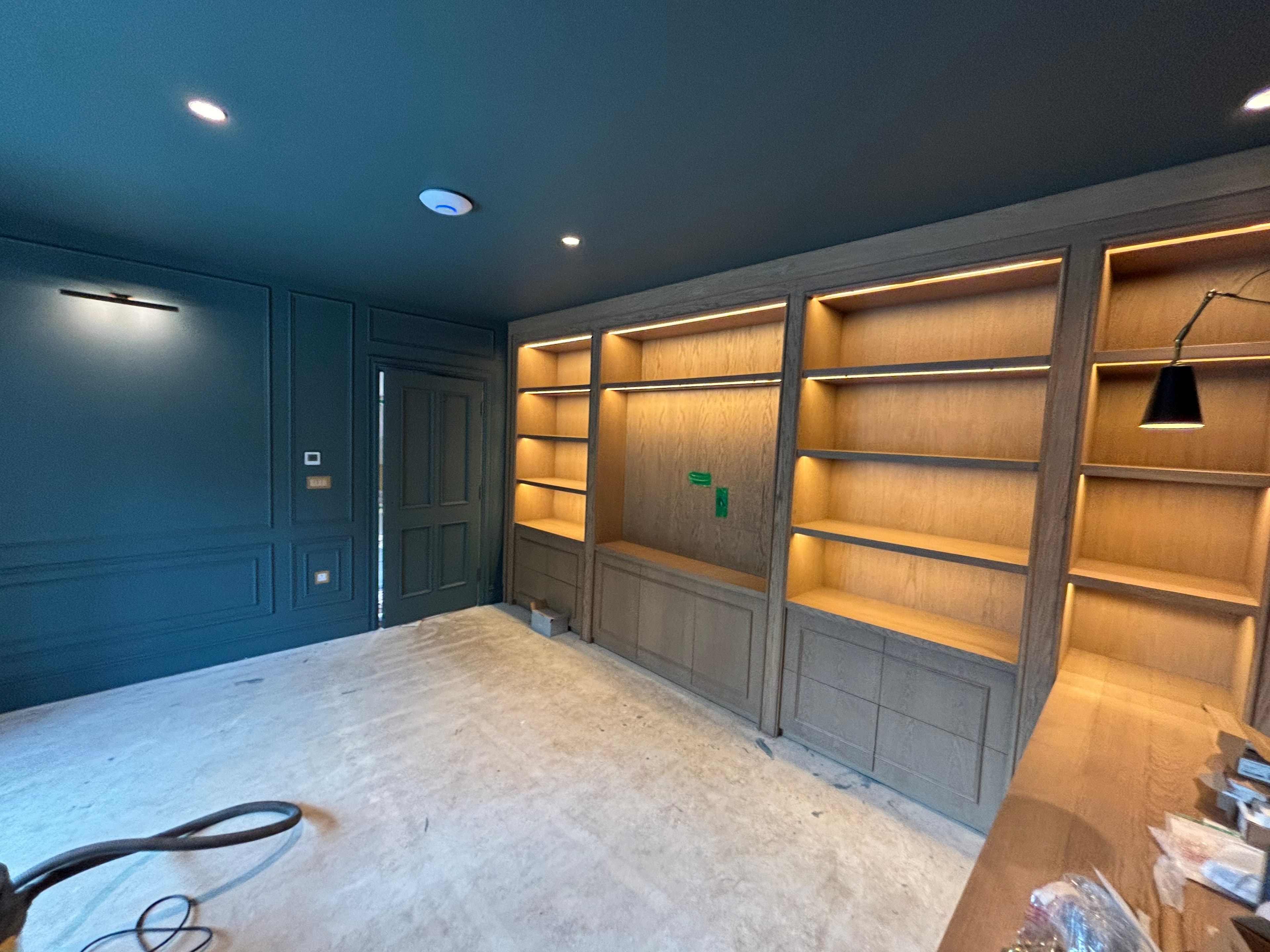 Illuminated shelving and lighting installation